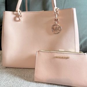 Blush pink Michael Kors shoulder bag with matching wallet.